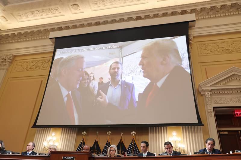 Former US president Donald Trump appears in a video shown on a screen during the hearing. EPA
