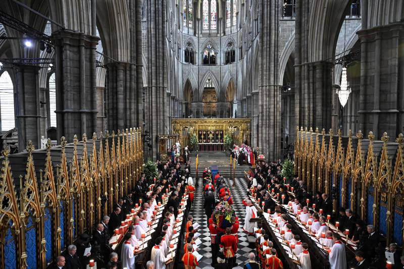 The coffin of Queen Elizabeth, draped in a Royal Standard and adorned with the Imperial State Crown and the sovereign's orb and sceptre, arrives in Westminster Abbey. AP