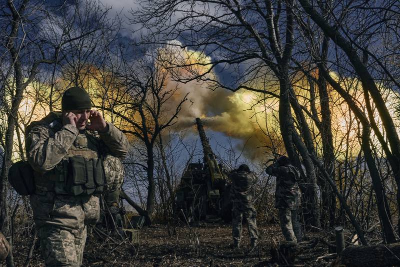 Ukrainian soldiers fire a howitzer towards Russian positions, near Bakhmut in Ukraine. AP