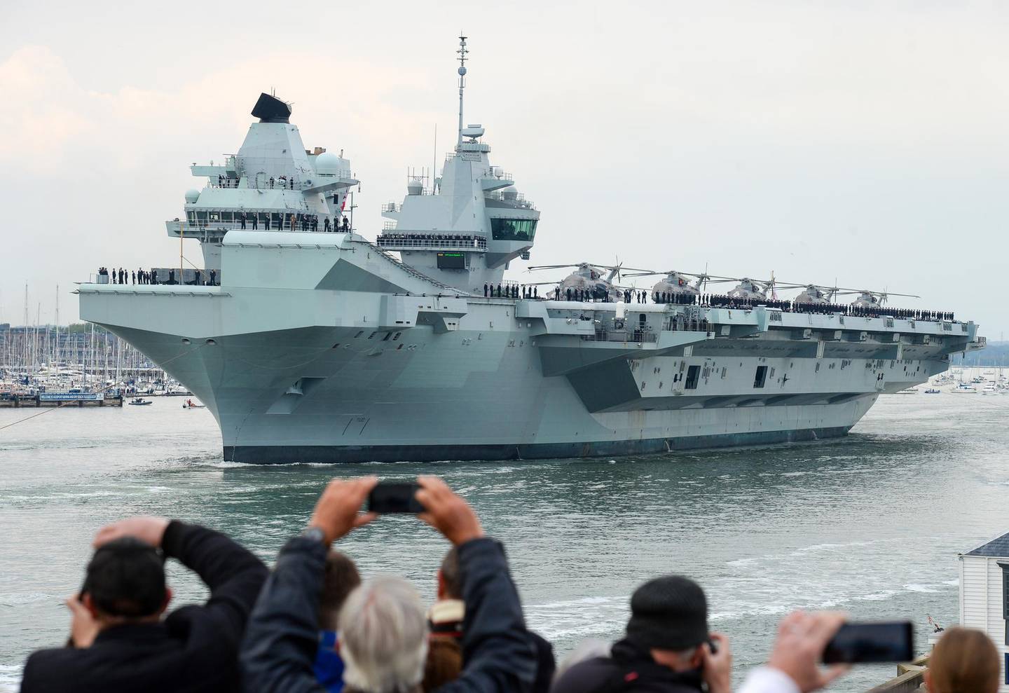 PORTSMOUTH, ENGLAND - MAY 01: HMS Queen Elizabeth leaves Portsmouth on May 01, 2021 in Portsmouth, United Kingdom. The UKâ€™s Carrier Strike Group, led by aircraft carrier HMS Queen Elizabeth, will visit more than one fifth of the worldâ€™s nations during the deployment. The task group will visit 40 nations covering 26,000 nautical miles. Joining HMS Queen Elizabeth on her maiden deployment are destroyers HMS Diamond and Defender, frigates HMS Richmond and Kent, an Astute-class submarine in support and Royal Fleet Auxiliary support ships RFA Fort Victoria and RFA Tidespring. (Photo by Finnbarr Webster/Getty Images)