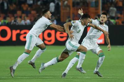 Algeria's Baghdad Bounedjah, centre, celebrates opening the scoring in the second minute. AP