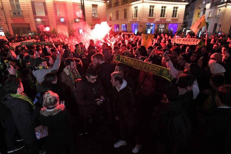 Nantes supporters light flares during the gathering. AFP