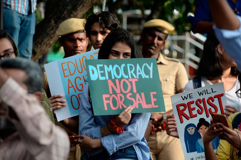 Students and demonstrators hold placards during a protest against India's new citizenship law in Chennai on December 19, 2019. Indians defied bans on assembly on December 19 in cities nationwide as anger swells against a citizenship law seen as discriminatory against Muslims, following days of protests, clashes and riots that have left six dead. AFP