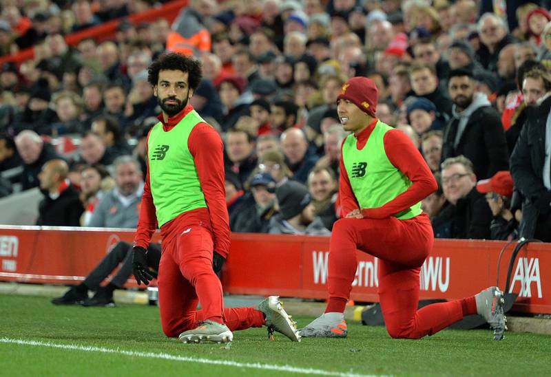 Mohamed Salah and Roberto Firmino warm up during the Premier League match between Liverpool  and Everton. EPA