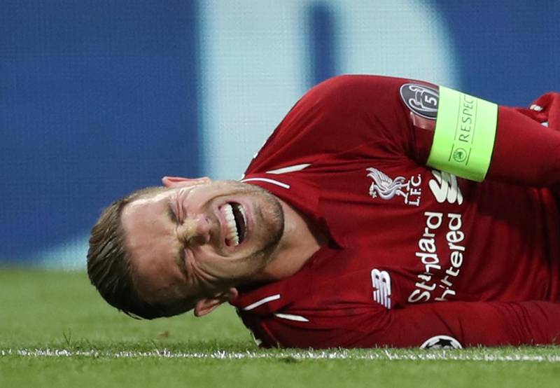 Jordan Henderson cries out in agony with a twisted knee, Reuters