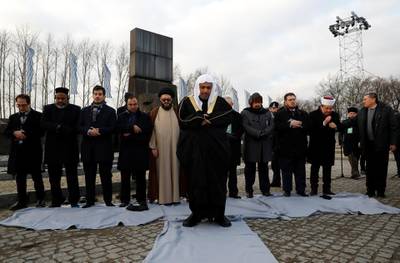 Mohammad Al-Issa prays during a visit at Auschwitz II Birkenau. Reuters