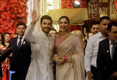 Bollywood actors Deepika Padukone and Ranveer Singh arrive to attend the wedding. AP Photo