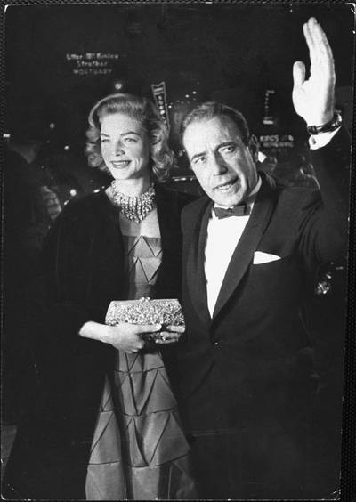 HOLLYWOOD, CA - MARCH 30:  Actor Humphrey Bogart, nominated for Best Actor for his performance in The Caine Mutiny, and his actress wife Lauren Bacall arrive prior to the 27th Annual Academy Awards ceremony on March 30, 1955 at the RKO Pantages Theatre in Hollywood, California. (Photo by George Silk/The LIFE Picture Collection via Getty Images)