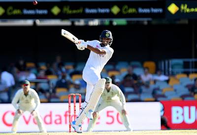 Washington Sundar hits the ball over the boundary for a six during day five of the 4th Test. Getty Images