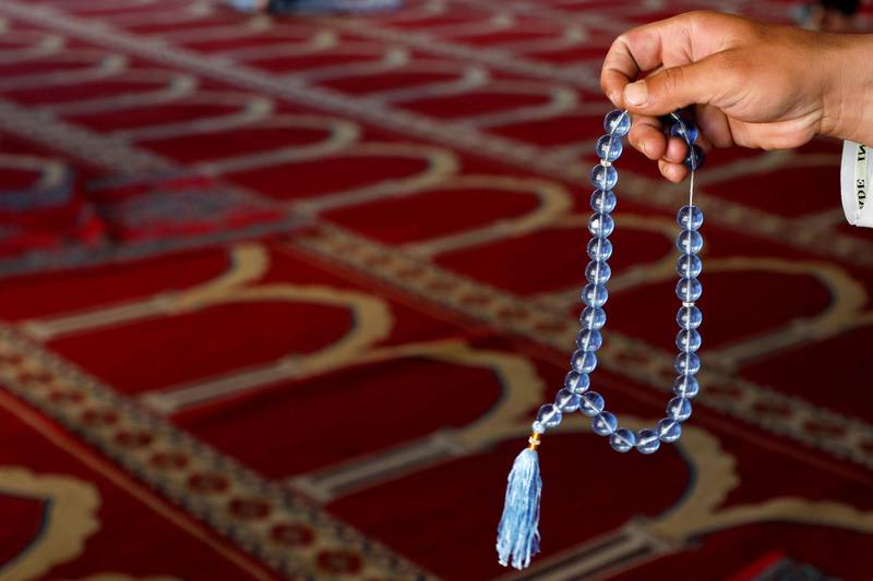 A man uses prayer beads at a mosque during the holy month of Ramadan in Kabul, Afghanistan. Reuters