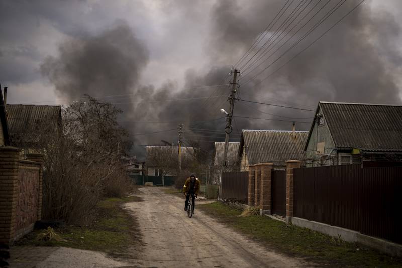 Smoke rises after a building was struck during Russia's military offensive in Irpin on Sunday. AP