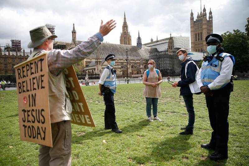 A religious preacher argues with Extinction Rebellion demonstrators. Getty