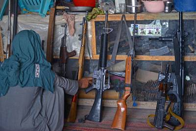 A vendor displays guns for sale at a market in the Panjwai district of Kandahar province. AFP