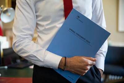 The Chancellor holds a copy of his Spring Statement. Photo: HM Treasury