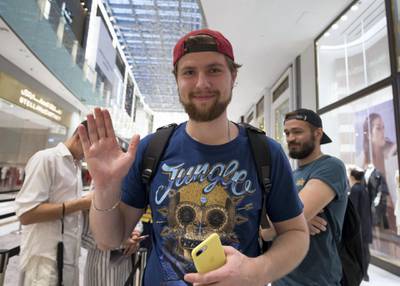 DUBAI, UNITED ARAB EMIRATES, 20 SEPTEMBER 2018 - Vladislav Mikheev from Russia the first person in line  get the new iphone XS at Apple store in Dubai Mall.  Leslie Pableo for The National for Patrick Ryan’s story