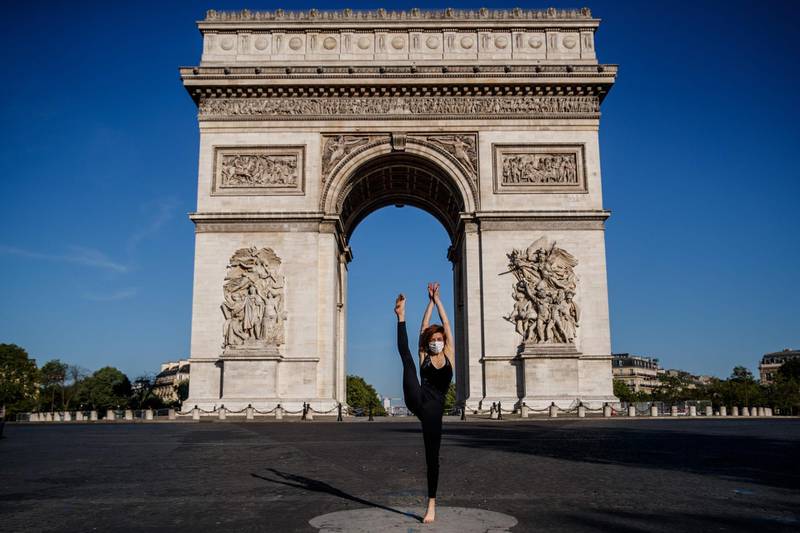 Syrian dancer and choreographer Yara al-Hasbani performs a dance in front of the Arc de Triomphe in Paris on the 37th day of a strict lockdown in France to stop the spread of COVID-19.  AFP