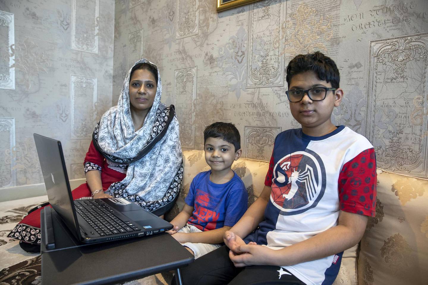 SHARJAH, UNITED ARAB EMIRATES. 15 APRIL 2021.  How parents teach children about charity during the Holy Month Of Ramadan. Farheen Matheranwala with her sons Mohammed and Hussain. (Photo: Antonie Robertson/The National) Journalist: Deepthi Nair. Section: National.
