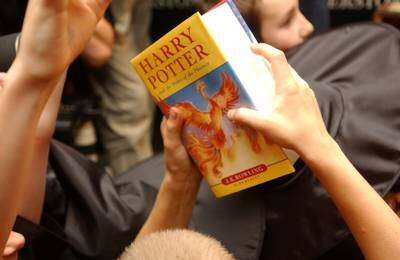 A young reader holds a copy of 'Harry Potter and the Order of the Phoenix', the fifth book of the series. Reuters
