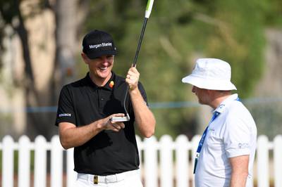 England's Justin Rose chats to putting coach Phil Kenyon. Getty