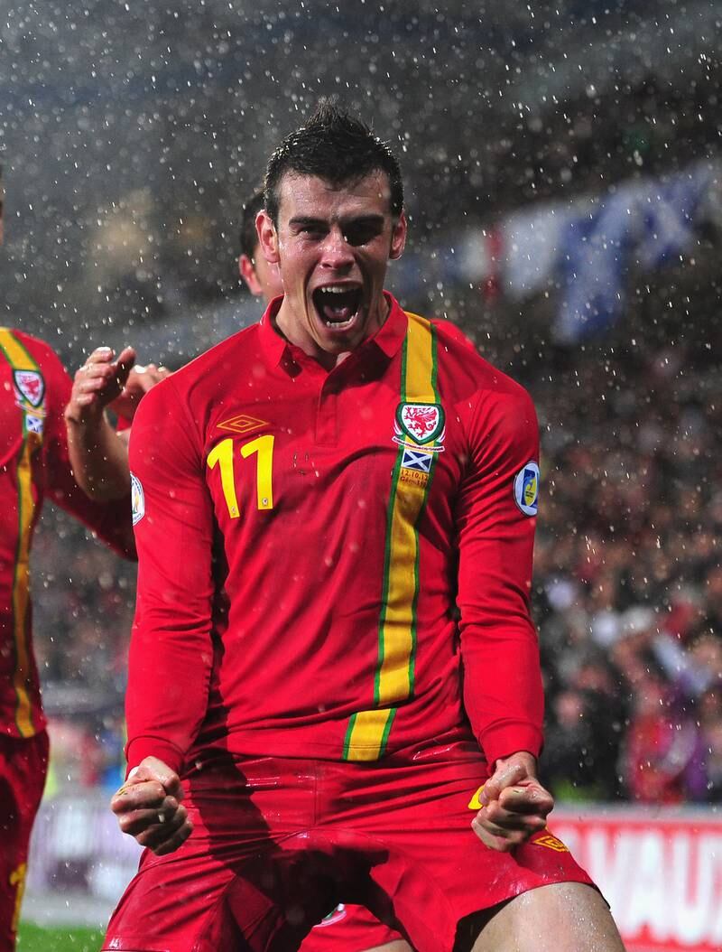 Gareth Bale celebrates scoring for Wales in their World Cup qualifier against Scotland at Cardiff City Stadium in October 2012. Getty