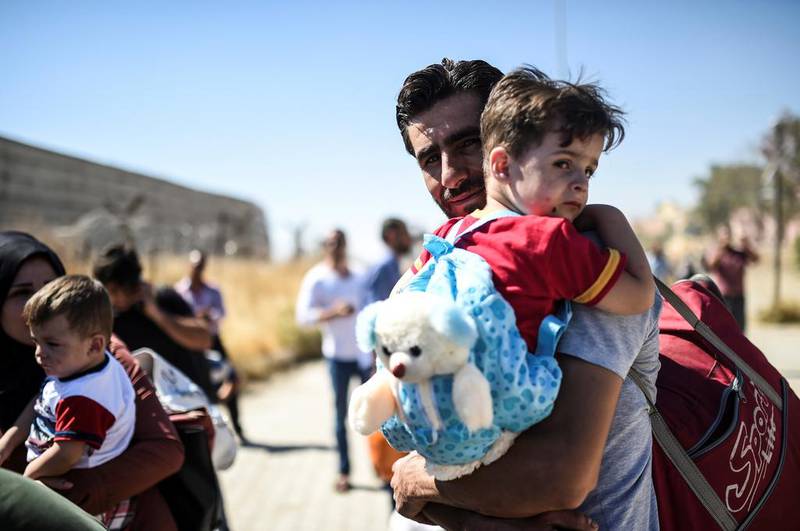 The UAE is to take a further step – that of allowing up to 15,000 Syrians to enter the country as refugees over the next five years, to add to thosewho have already arrived, but do not have formal refugee status. Bulent Kilic / AFP


