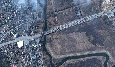 Cars stuck at the Irpin River bridge, as Russia unleashes a barrage of air strikes on cities across Ukraine. AFP