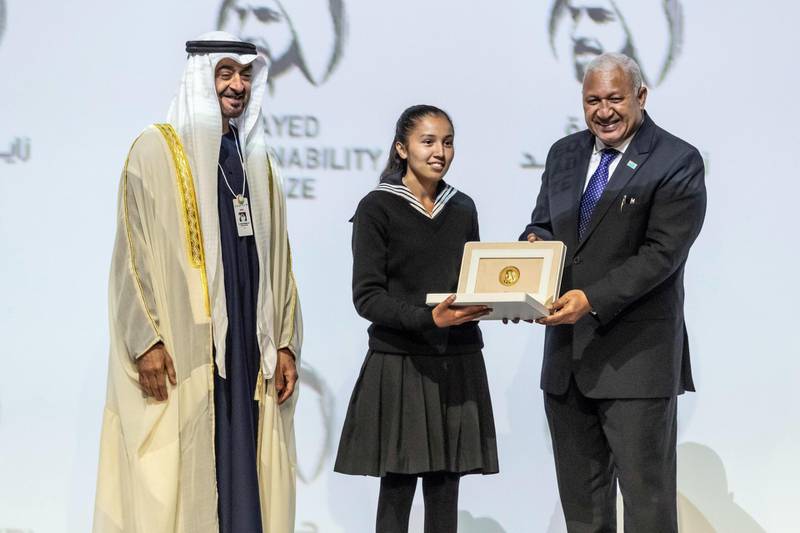 ABU DHABI, UNITED ARAB EMIRATES. 13 JANUARY 2020. The Zayed Sustainability Awards held at ADNEC as part of Abu Dhabi Sustainability Week. H.E. Sheikh Mohammed bin Zayed Al Nahyan, Crown Prince of Abu Dhabi and Deputy Supreme Commander of the United Arab Emirates Armed Forces awards Global High Schools Winner: South Asia, Bloom Nepal School, Nepal with the Prime Minister of Fiji, Frank Bainimarama. (Photo: Antonie Robertson/The National) Journalist: Kelly Clarker. Section: National.