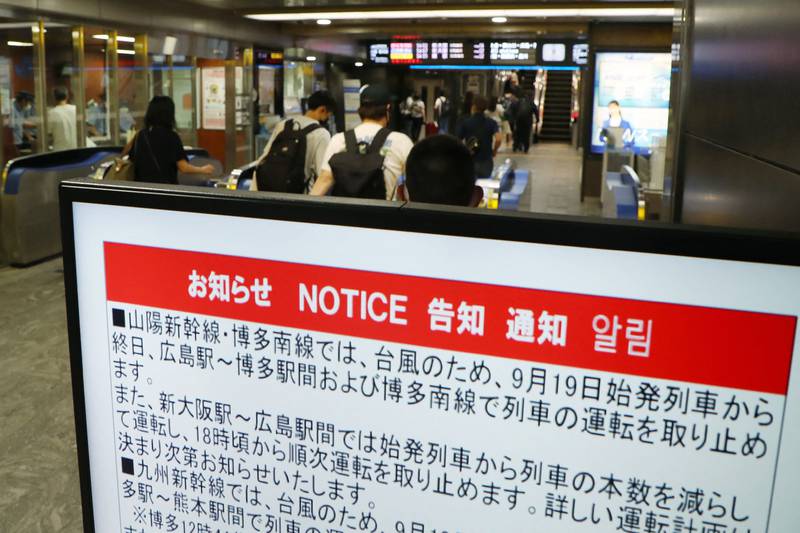 A sign at Hakata station notifies commuters of the suspension of train services. AFP