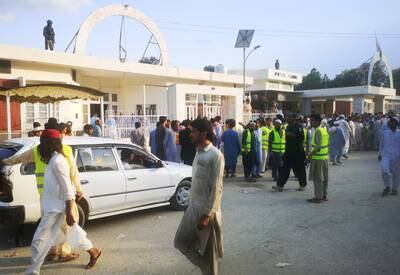 Rescue workers outside a hospital after a blast aimed at a gathering of political party Jamiat Ulma-e-Islam-Fazl in Bajaur, Pakistan, on July 30.  At least 44 people were killed.  EPA