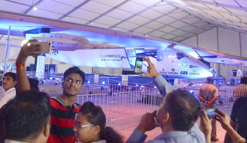 Visitors photograph Solar Impulse 2 at Sardar Vallabhbhai Patel International Airport in Ahmedabad on Friday. Sam Panthaky / AFP

