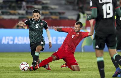 ABU DHABI , UNITED ARAB EMIRATES , January 21 – 2019 :- Bandar Mohamed Al Ahbabi ( no 9 in green UAE ) in action during the AFC Asian Cup UAE 2019 football match between UNITED ARAB EMIRATES vs. KYRGYZ REPUBLIC held at Zayed Sports City in Abu Dhabi. ( Pawan Singh / The National ) For News/Sports