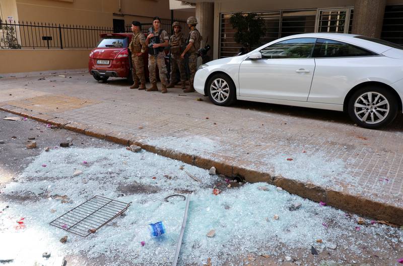 Shattered glass on floor as soldiers are deployed. Reuters