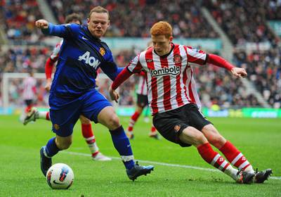 SUNDERLAND, ENGLAND - MAY 13: Wayne Rooney of Manchester United in action with Jack Colback of Sunderland during the Barclays Premier League match between Sunderland and Manchester United at the Stadium of Light on May 13, 2012 in Sunderland, England.  (Photo by Michael Regan/Getty Images)
