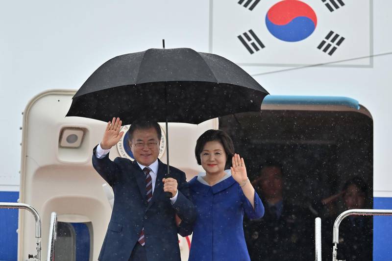 South Korea's President Moon Jae-in and his wife Kim Jung-sook arrive at Kansai airport in Izumisano city, Osaka prefecture,  ahead of the G20 Osaka Summit. AFP