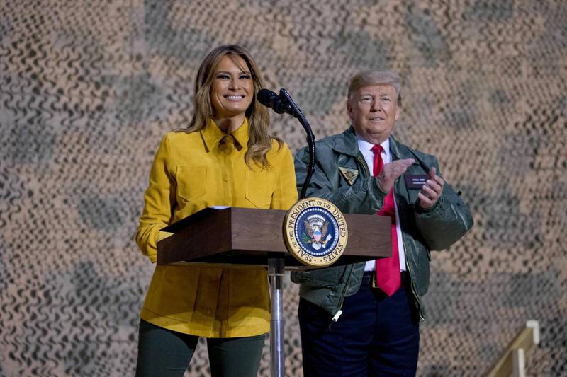 First lady Melania Trump, left, accompanied by President Donald Trump, pauses as she speaks at a hanger rally at Al Asad Air Base, Iraq. AP Photo