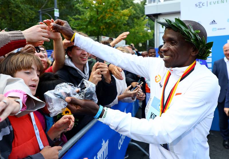  Eliud Kipchoge celebrates with spectators after winning the Berlin Marathon. Reuters