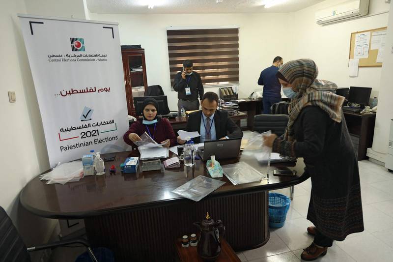 Employees of the Central Elections Commission prepare documents at the Commission's office in Gaza City, at the start of the registration period for the May parliamentary election. AFP