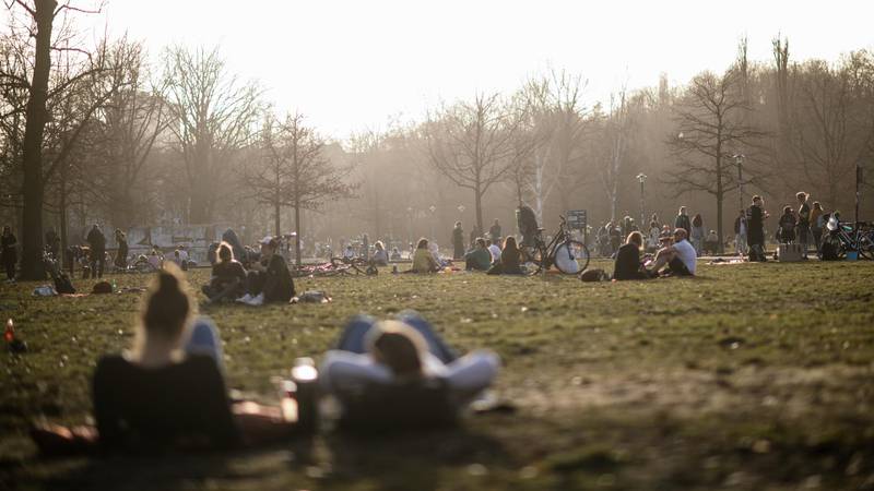 People sit in the Volkspark am Friedrichshain park on a sunny afternoon in Berlin, Germany. EPA