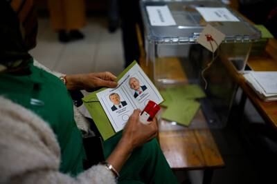 A woman holds a ballot in Istanbul. Reuters