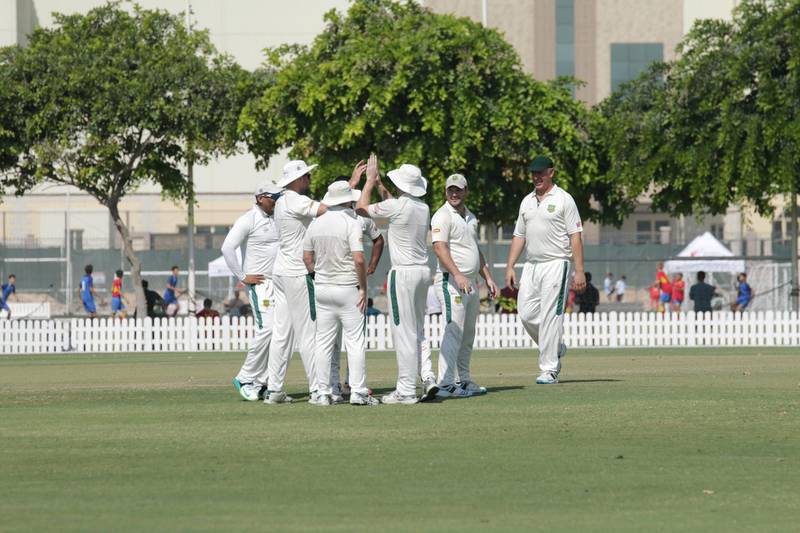 Dubai, UAE - November 4, 2017 - The Darjeeling Cricket Club players celebrate in a huddle after taking a wicket during a warm up match for the GCC Sixes tournament - Navin Khianey for The National