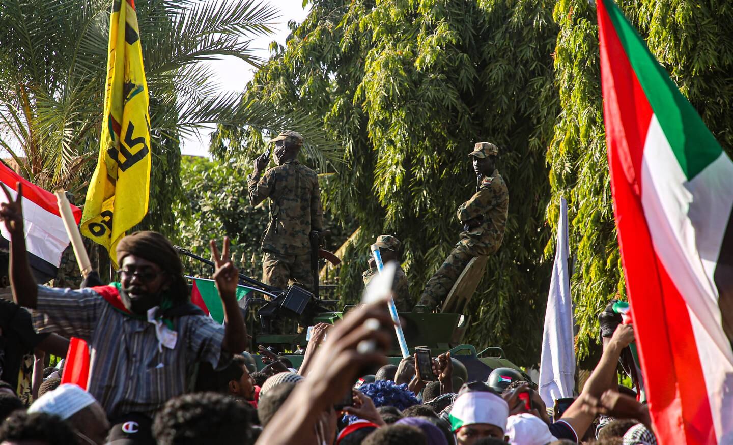 Sudanese security forces guard the Republican Palace in Khartoum after protesters reached it. EPA