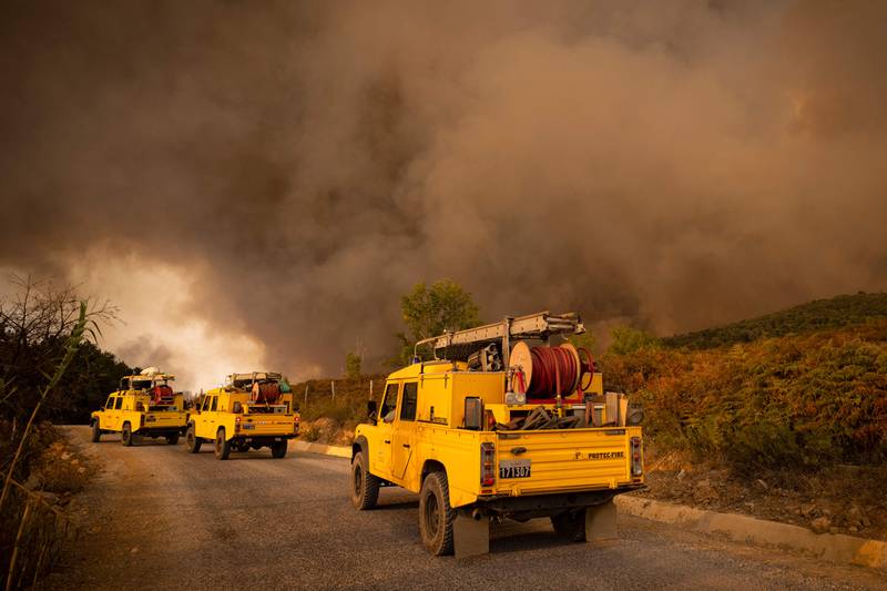 Rescue teams rush to the scene of wildfires sweeping through forests in the region of Chefchaouen in northern Morocco.