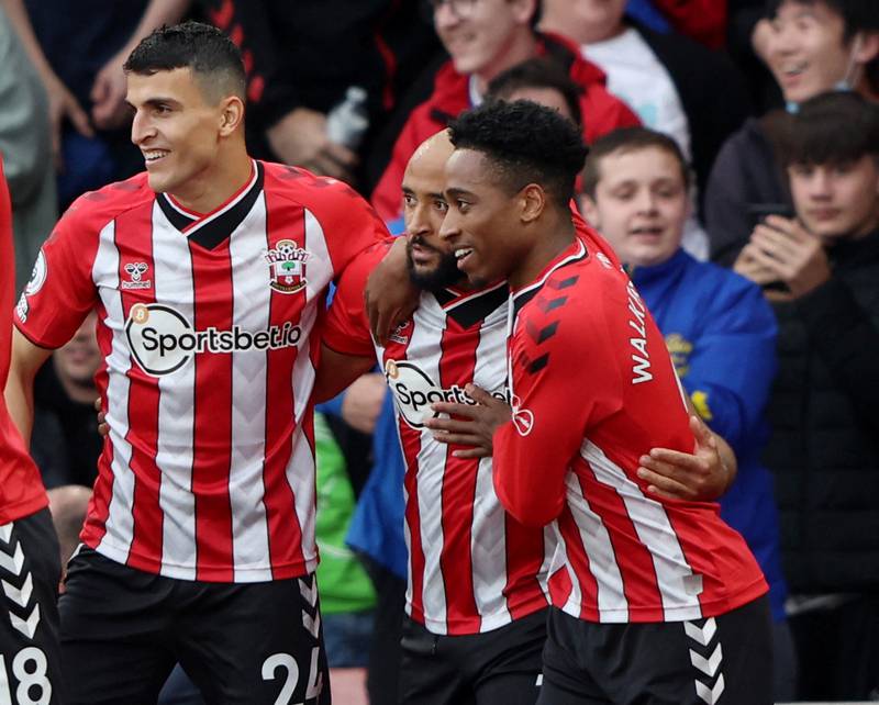 Nathan Redmond celebrates scoring their first goal with Mohamed Elyounoussi and Kyle Walker-Peters. Reuters