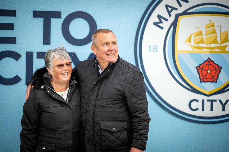 Feature on Manchester City FC at the Etihad complex and Manchester city centre.PIC shows fans Rob Booth and Sue Booth.