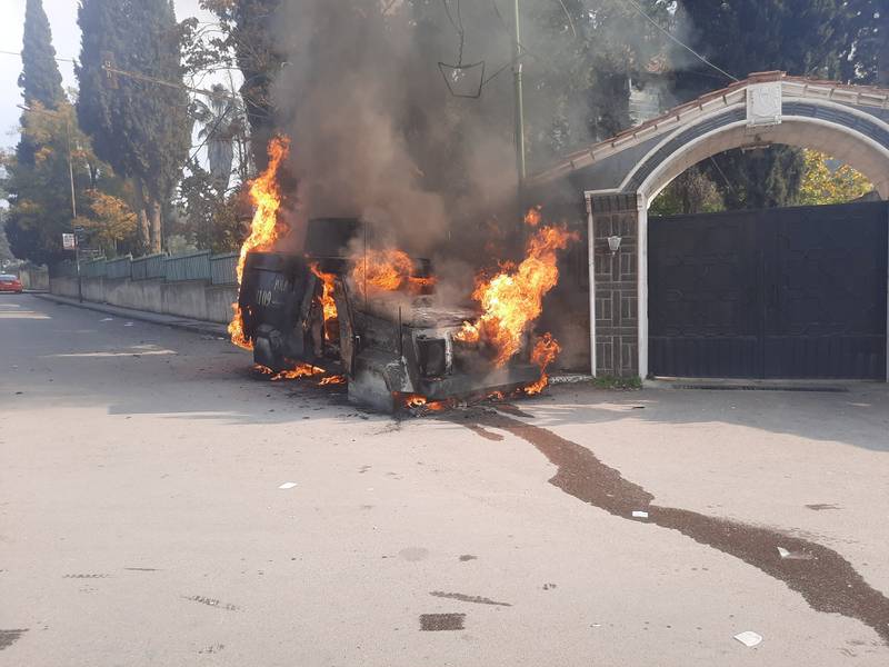 A police vehicle burns. Reuters