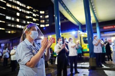 NHS staff members gather outside the University Hospital of North Tees to show their respects and applaud Captain Sir Tom Moore. Getty Images