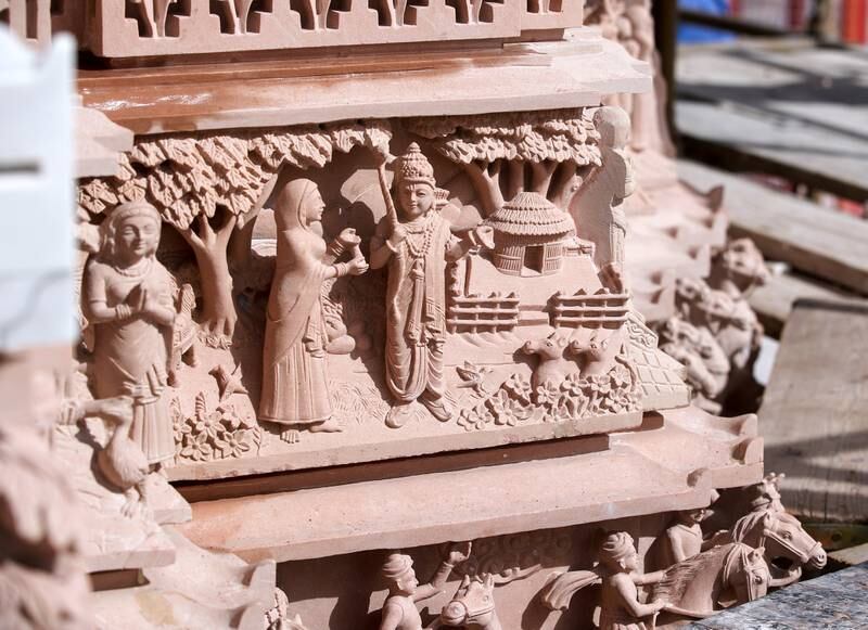 When the temple opens in February next year, visitors will see these pink sandstone carvings that tell stories from Hindu scriptures