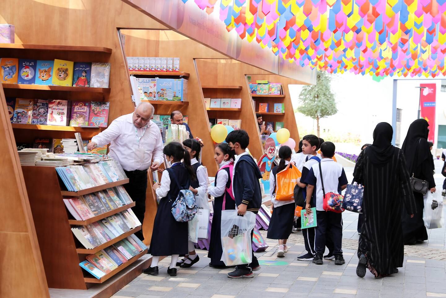 School pupils at the opening day of the Al Ain Book Festival at Hazza Bin Zayed Stadium. Pawan Singh / The National 