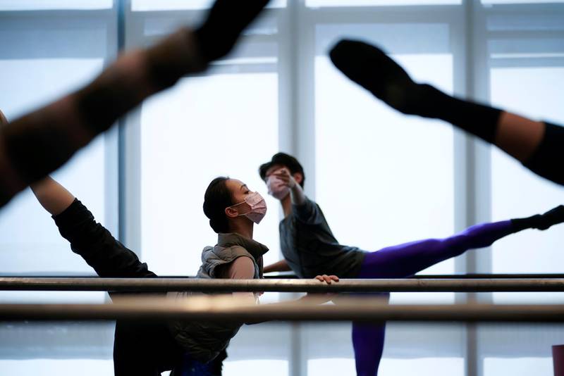 Shanghai Ballet dancers wearing masks practise in a dance studio in Shanghai. Reuters