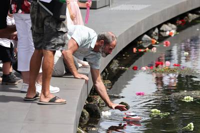 A family member of one of the 185 victims releases a toy boat into the Avon River during the national memorial service. Getty Images